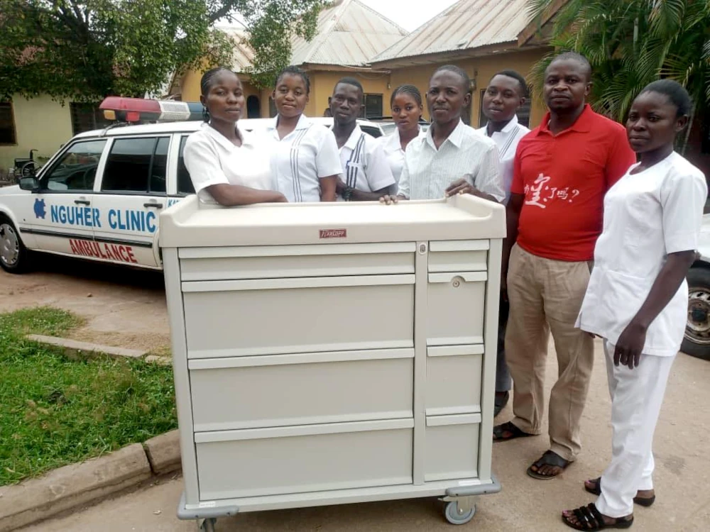 Medical staff around donated cart